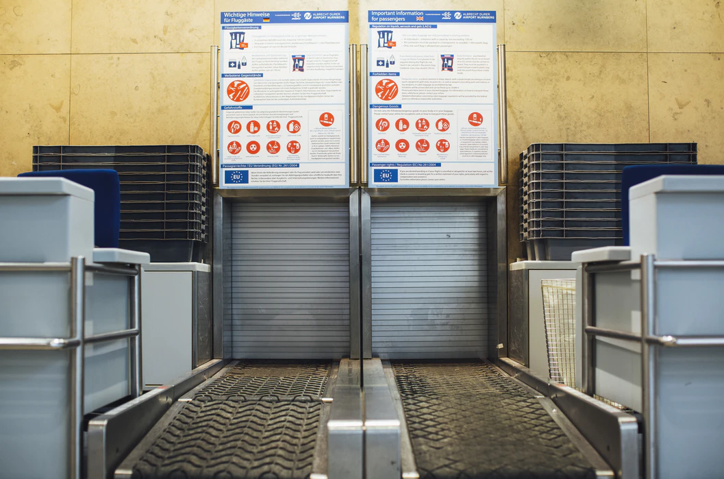 Image of baggage check-in at an airport.